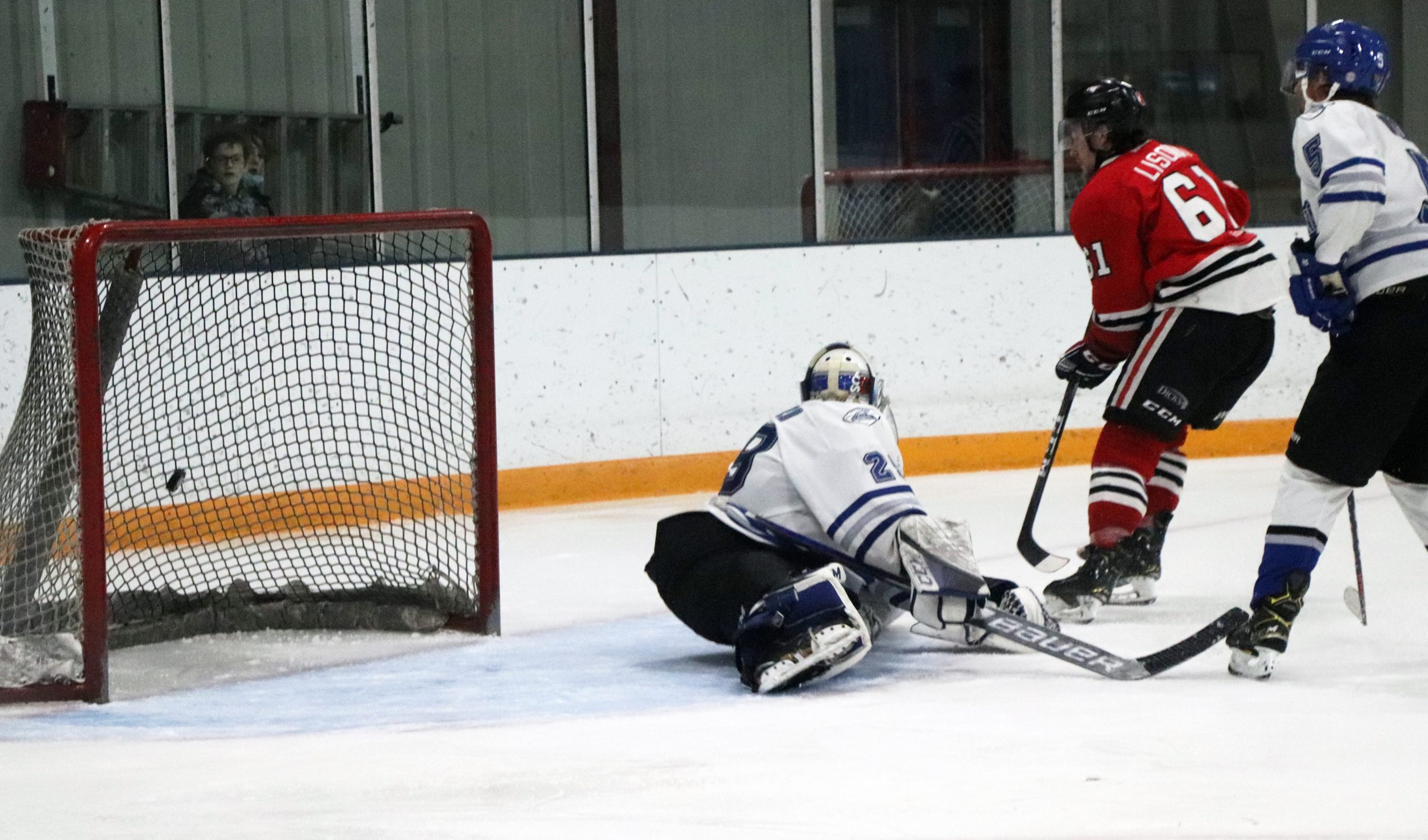 Photo of Quintin Lisoway scoring off a rebound