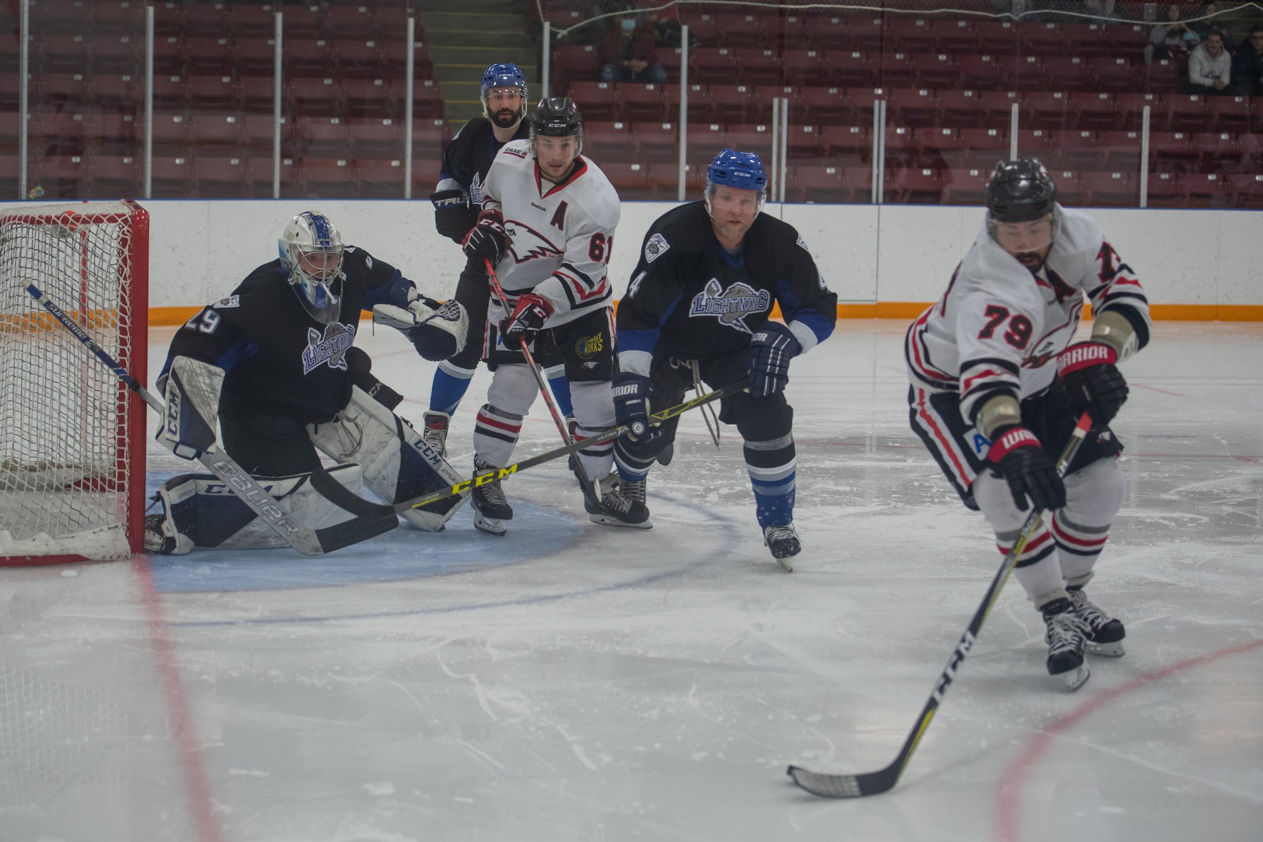The Eagles' Quintin Lisoway is dangerously in front of the Lethbridge Lightning net as his teammate Kyle Sheen chases the puck. Innisfail went on to win 8-5 with Lisoway notching a hat trick. Photo by Janise Michel of Lethbridge Sports (IG: @by.janise)